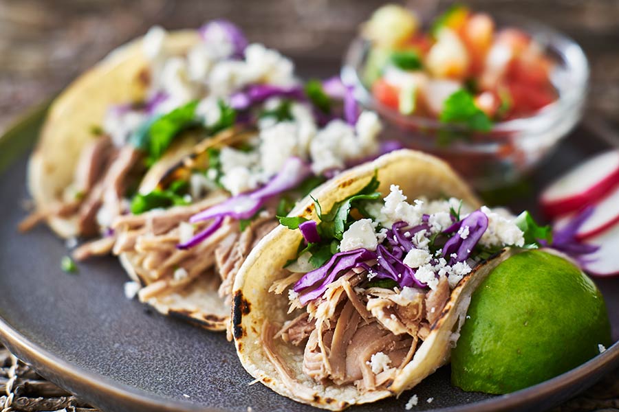 bigstock-Street-tacos--with-carnitas--225381346